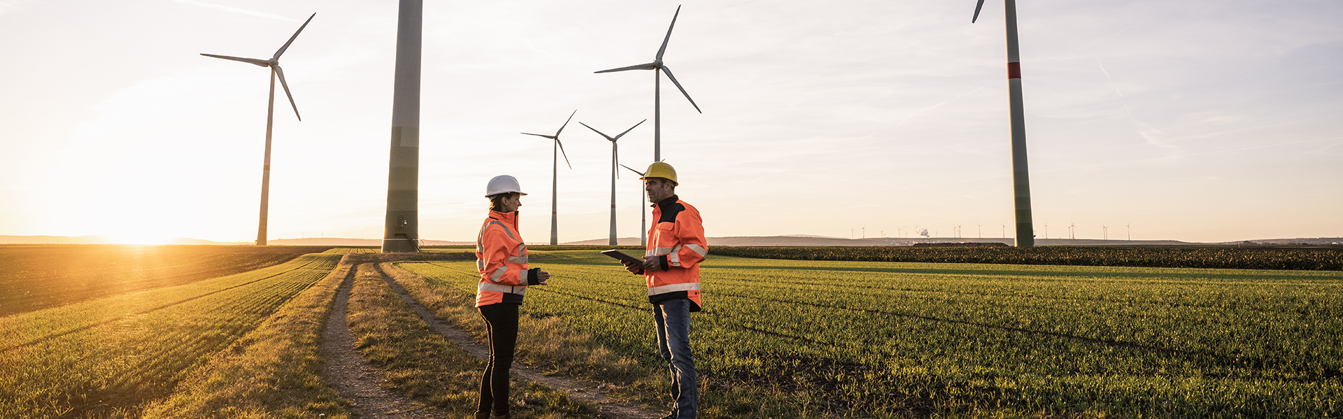 Onshore wind turbines and two surveyors