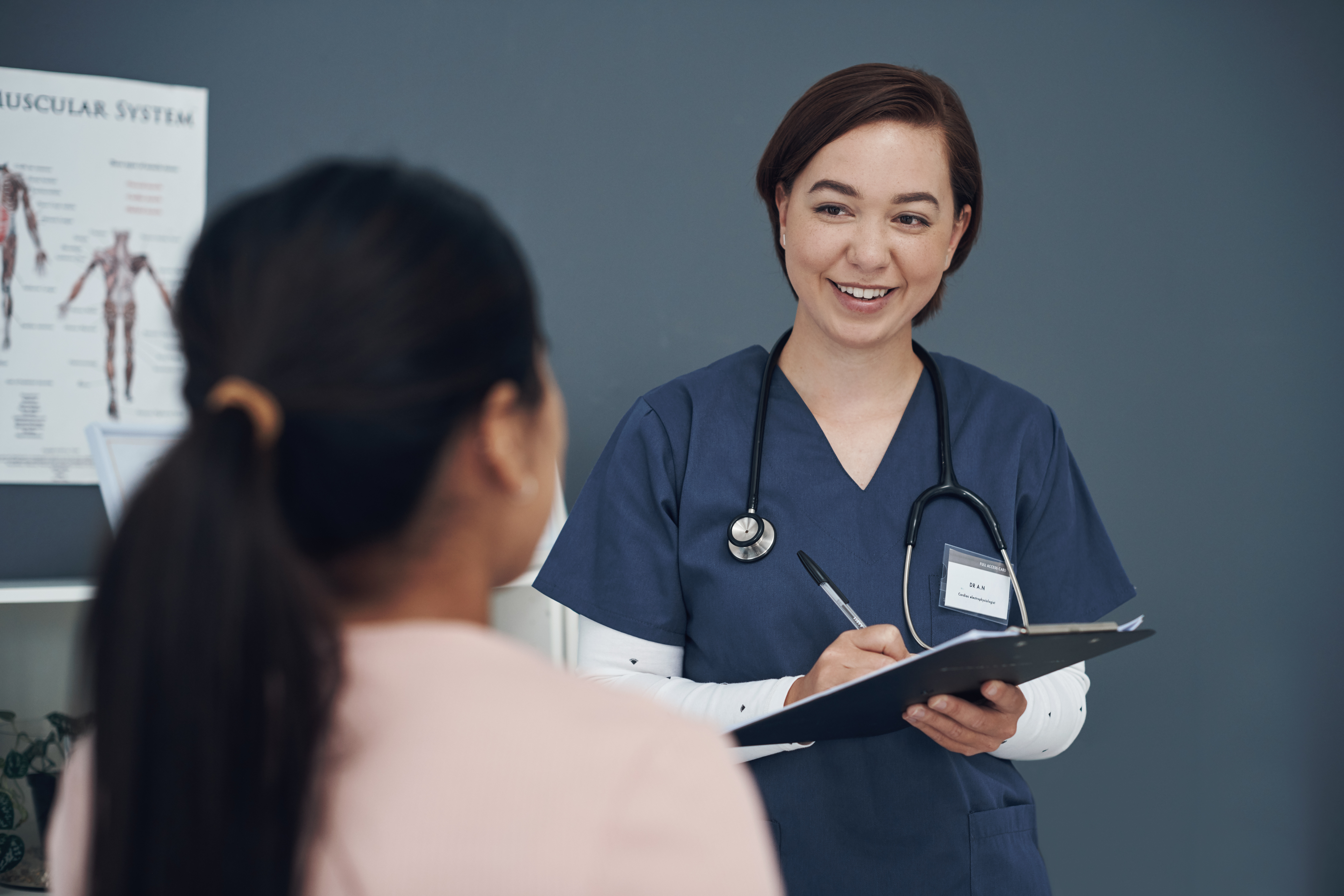 Nurse consulting with a patient in a critical access hospital implementing DNV NIAHO® accreditation standards