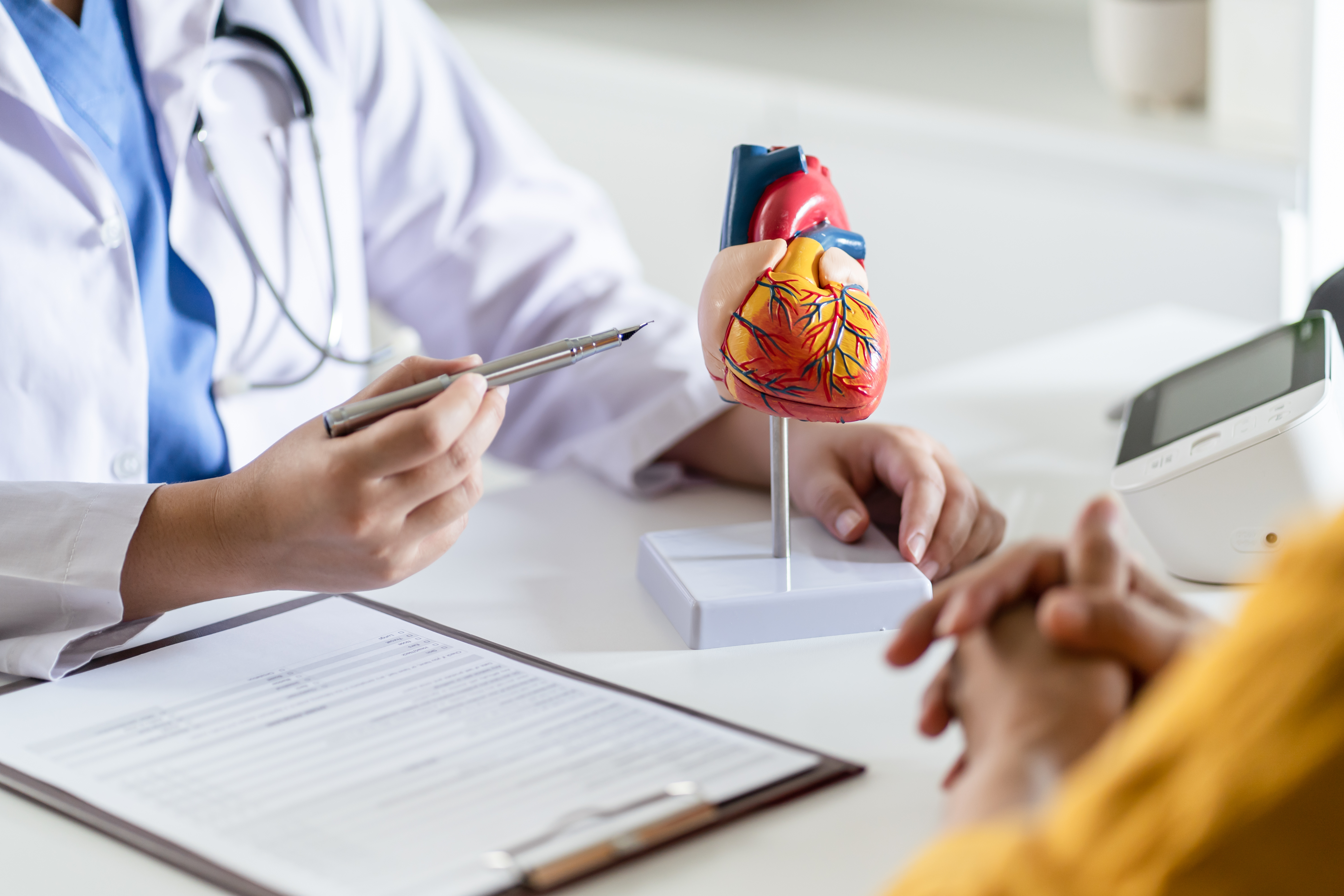 Cardiology specialist reviewing treatment plans in a VAD program pursuing DNV ventricular assist device credentialing