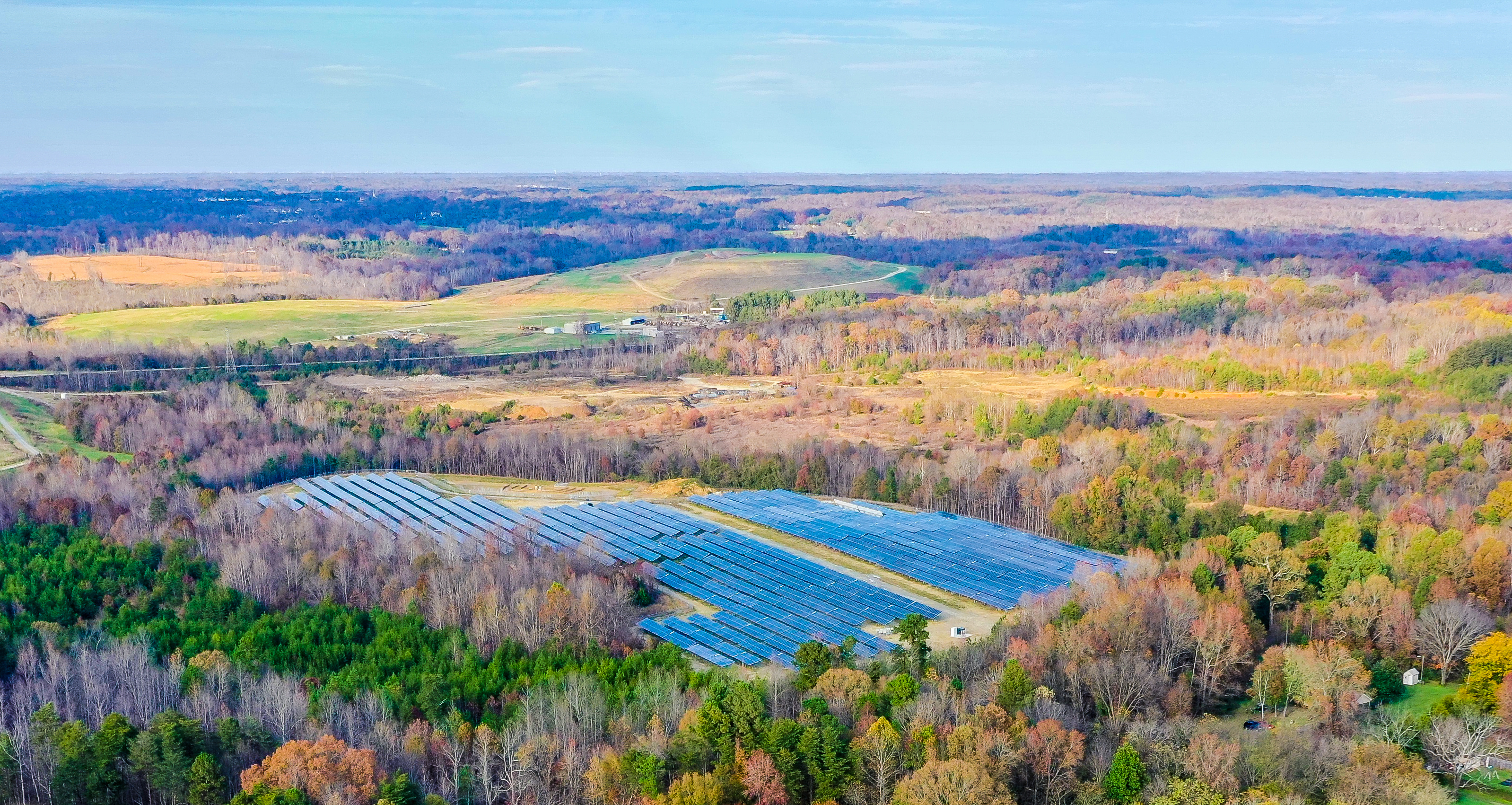 Expansive natural landscape with water and vegetation, representing environmental integrity and aligned Climate Bonds verification
