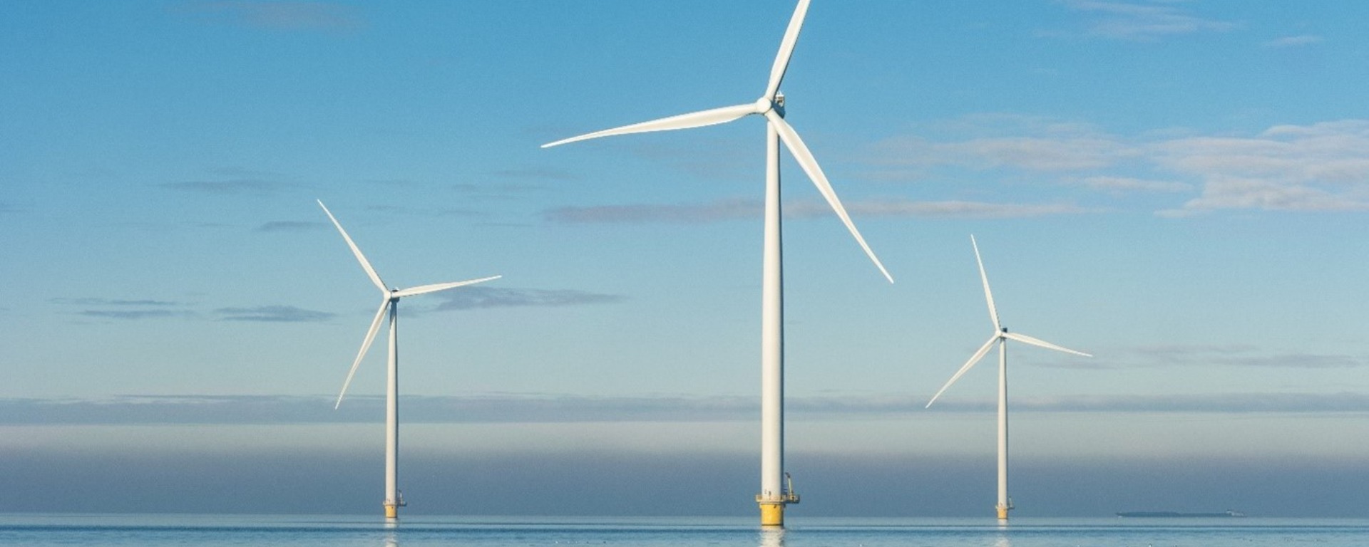 three offshore wind turbines