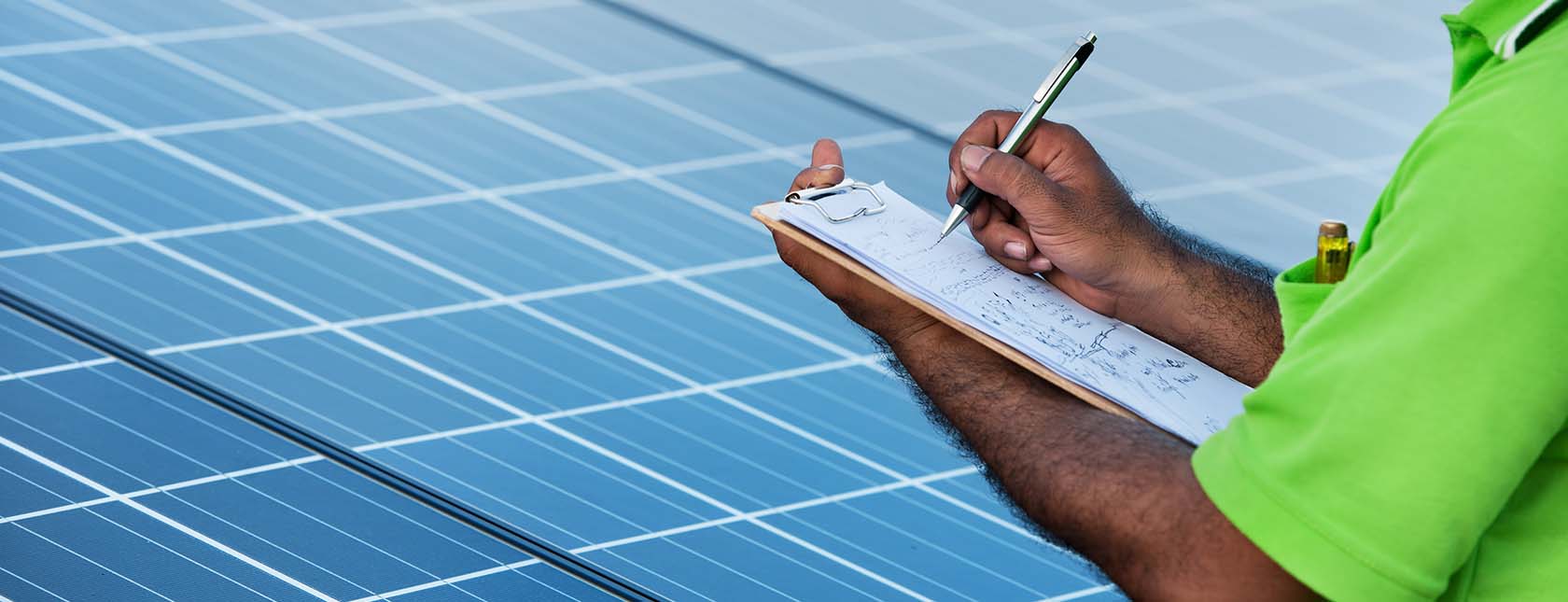 solar panels and grid worker